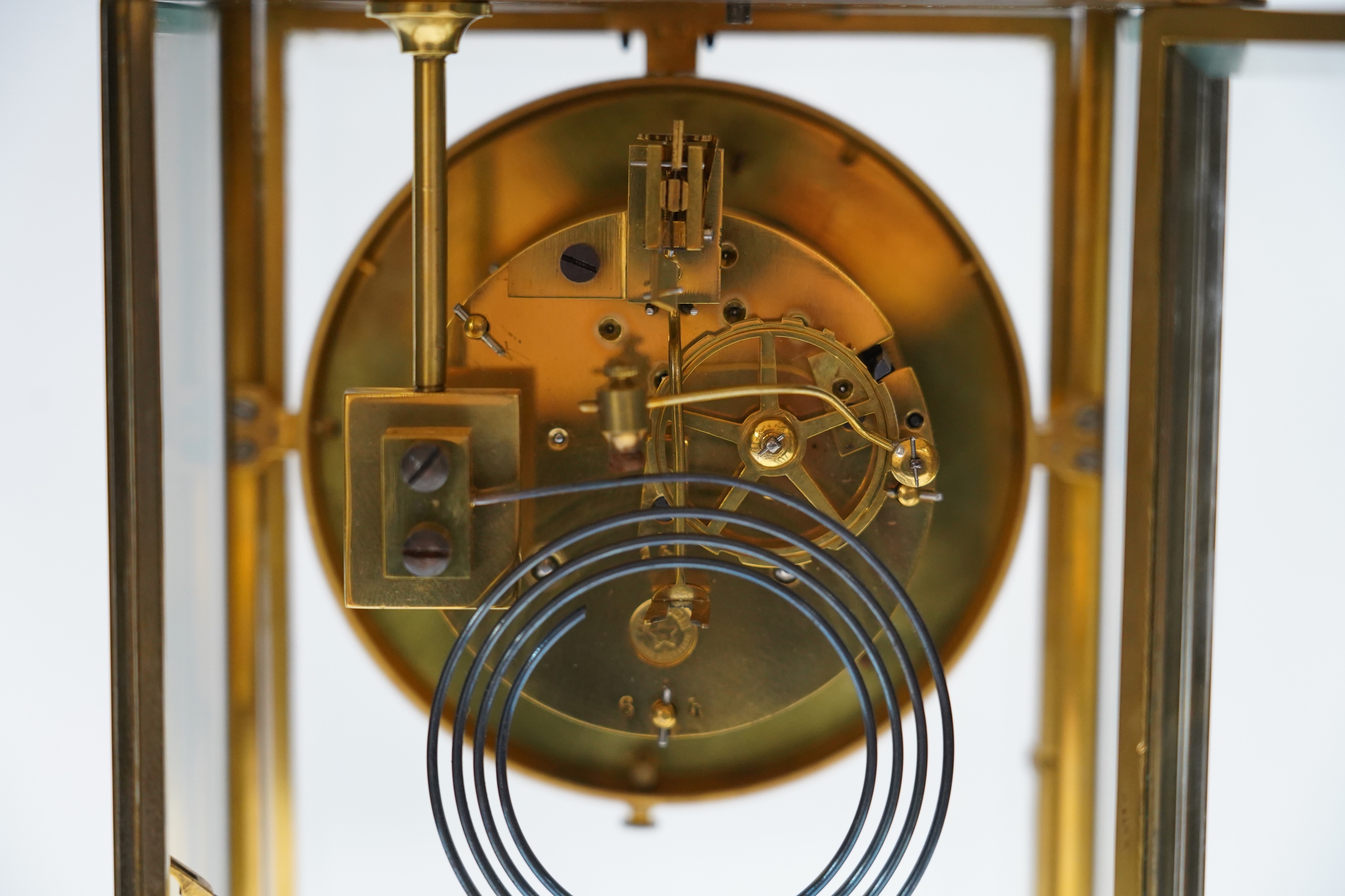 A French four glass mantel clock with mercury suspension and pendulum, 33cm